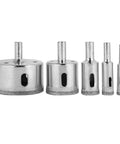 Front view of 5-piece coated hole saw set with pilot bits, 3-50 mm, for tile and ceramic drilling.