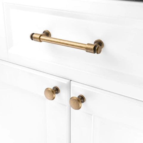 No Fuss Antique Brass Cabinet Pulls Ten Pack Five Inch Drawer Handles Heavy Duty Solid Metal Hardware on white cabinetry