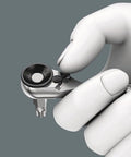 Close-up of hand holding 0.25 inch hex drive from Tool Check Plus Imperial 39 Piece Bit And Socket Set With Color Coding For Quick Identification
