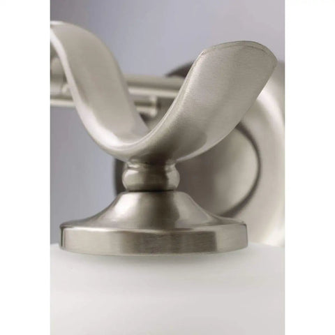 Close-up of Inspire Collection Four-Light Bath Vanity Light with brushed nickel finish mounting detail.