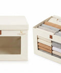 Two Beige Badass No Frills Fabric Boxes With Secure Snap Lids And Grippy Handles Clear Front Panel for clothes.