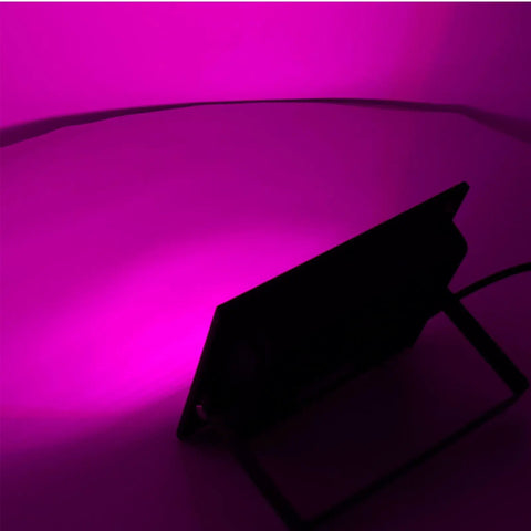 SUNGOOYUE LED Flood Light RGBW Color Changing emitting pink light, angled view showcasing sleek design.