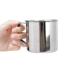 Hand holding Solo Camping Stainless Steel Outdoor Tableware Set cup, part of rustproof mess kit for camping, hiking, and picnics, lightweight and durable.