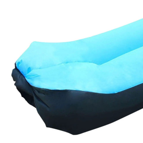 Close-up of blue inflatable lounger camping couch for adults and kids, air sofa chair, portable for beach, backyard, hiking, festivals, and travel.
