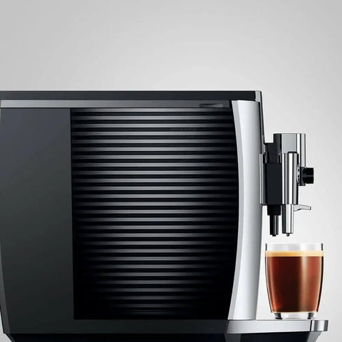 Level Up Your Daily Grind With This Sleek Chrome Automatic Coffee Machine Boasting One Touch Operation Built In Grinder And Rich Foam Frother For A Real Deal Barista Experience Certified Refurbished, coffee machine side view with espresso cup.