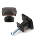 Close-up of Ten Pack Oil Rubbed Bronze Cabinet Knobs Set For Cabinets And Drawers Square Single Hole Pulls For Dresser Cupboard Bedroom Closet And Bathroom Vanity Made From Solid Metal For Durable Easy Install Hardware The Best Bang For Your Buck showing two knobs, screws visible.