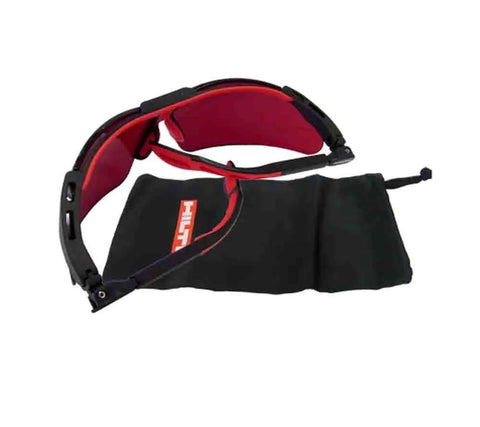 Protective glasses with black and red design next to a soft black case for Pro Grade Laser Range Finder Built To Crush It On The Job