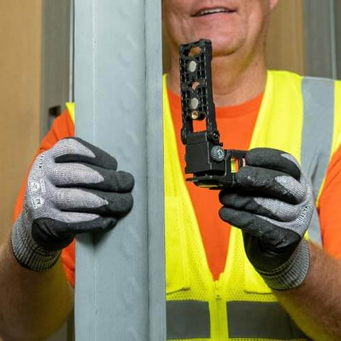 Person holding Magnetic Pocket Laser Level With 360 Degree Wall Attachment, Red Laser Line Reaches 30 Feet, 3 Bubble Vials