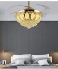 Top Notch 52 Inch Gold Ceiling Fan With Light, Fresh Crystal Lotus Frame, illuminating a stylish bedroom with grey accents.