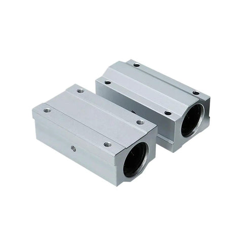 Runs Slick Long Type Linear Motion Ball Bearing Aluminum Slide Bushing Block For CNC Machines And 3D Printers Built Tough Low Friction Guide Rail Assembly, close-up view of two aluminum blocks.