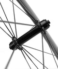 Close-up of Pro Grade 700C Carbon Clincher Front Wheel For Road Bikes Ride Ready Ultralight Full Carbon Fiber hub details
