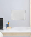 Heavy Duty Clear Acrylic Under Desk Laptop Holder Mount With Reliable Adhesive And Screws Wall Mounted Bracket on wall above desk.