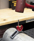 Strong Hand magnetic pipe centering head MPCH250 on steel pipe with red anodized aluminum body and 360-degree dial.