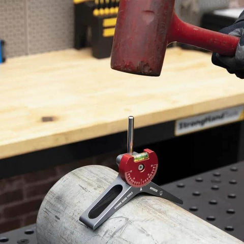 Strong Hand magnetic pipe centering head MPCH250 on steel pipe with red anodized aluminum body and 360-degree dial.