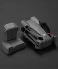 Intelligent Flight Battery Plus for Mini 5 Pro Delivers Up To 52 Minutes Of Flight Time with folded drone on dark surface