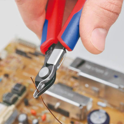 Electronics Snips With Lead Catcher And Comfort Grip, Induction Hardened Cutting Edges At 64 HRC in use on circuit board