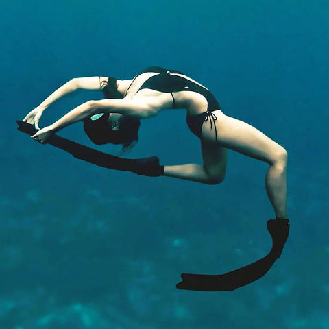 Diver with long blade diving fins for freediving and spearfishing, scuba swimming training gear with replaceable polypropylene blades underwater