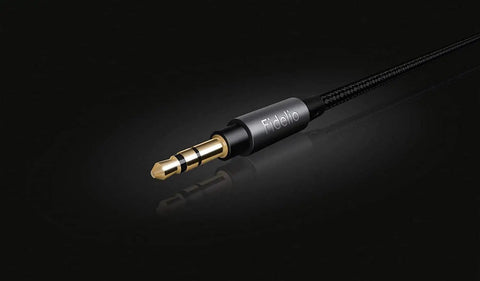 Close-up of detachable 3.5mm cable from Open Back Over Ear Wired Headphones With 50mm Neodymium Drivers Black Studio Monitor Quality