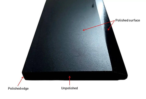 Close-up of Hollywood Beveled Absolute Black Granite Doorway Threshold Tile With Marble Saddle Polished Finish, showing polished edge.