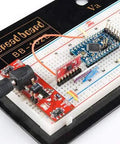 3.3V 8MHz Pro Mini ATmega328 Development Board on breadboard setup with connectors, displaying auto-reset and FTDI compatibility.