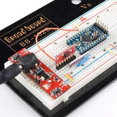 3.3V 8MHz Pro Mini ATmega328 Development Board on breadboard setup with connectors, displaying auto-reset and FTDI compatibility.