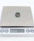 Fire 10 Pieces F688RS Flange Ball Bearings 8x16x5mm Chrome Steel For Motion Drive Units Idler Joints Zero Play Super Smooth Action Keeps Rig Tight Strong Under Pressure Maintains Peak Performance Without Fail Anytime You Build New Machines. single F688RS flange ball bearing on digital scale