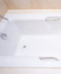 Universal Bathtub Drain Stopper, Stainless Steel Silicone, 42-44mm in a white bathtub with a chrome faucet.