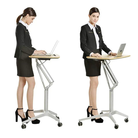 Hassle Free Pneumatic Sit Stand Laptop Desk Cart With Smooth Lever Adjustments, ergonomic mobile workstation in use.