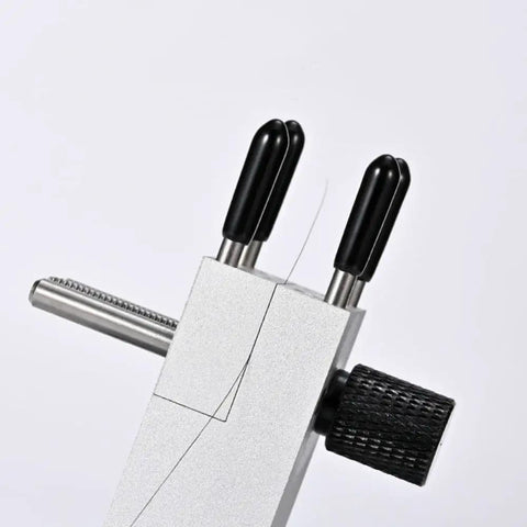 Close-up of Tabletop Mini Vise With 360 Degree Rotating Spherical Head, showing detachable clamp and stainless rods with silicone sleeves.