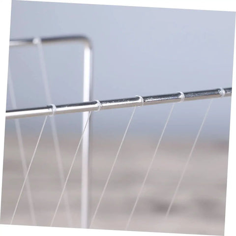 Close-up of Newton Pendulum Desk Toy For Home Office Decor Square Iron Balance Gadget That Makes Physics Fun, metal rods and strings visible.