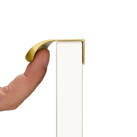 Side view of 10 Pack 5 Inch Matte Gold Finger Pulls For Cabinets And Drawers Brushed Brass Edge Hardware, installed on a white surface.