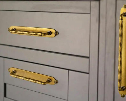 Five Inch Antique Brass Cabinet Pull Handles With Timeless Oval Backplates, Hella Durable Zinc Alloy Drawer Knobs For Kitchen Cabinets And Dressers, Rust Proof Two Pack Slick Smooth Handle Grip mounted on gray drawers.