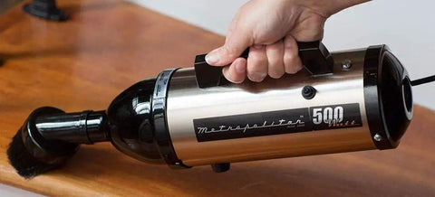 VM6SB500 500W 120V High Performance Hand Vacuum With All Steel Build And Beastly Suction in use on wood surface