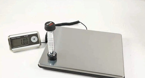 Heavy Duty Slick Digital Postal Scale With Crisp External Backlit Display Plug And Play Setup No Fuss Calibration High Precision Sensor Waterproof Stainless Platform For Shipping Parcels Up To Four Hundred Forty Pounds on a white background.