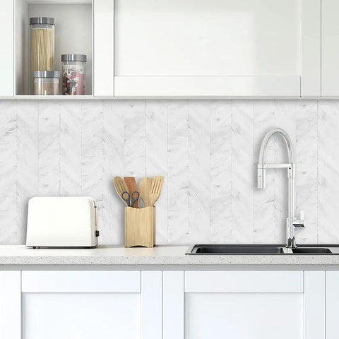 Modern kitchen with Herringbone Peel And Stick Backsplash Tiles White Marble Look PVC 12x12 Inch over counter and sink area.