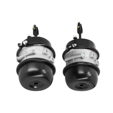 Two air brake chambers, 3 in bore, 30/30 long stroke, black ends with silver mounting flanges.