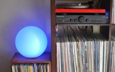 8 Inch Ultra Fun Led Glowing Ball Light With Remote RGB Color Changing Globe Mood Lamp on shelf beside vinyl records