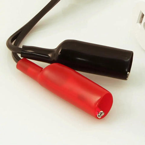 Close-up of 69411 Circuit Breaker Finder Accessory Kit with red and black alligator clips, part of durable electrical testing tools.