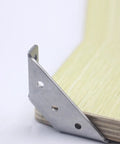 Close-up of a stainless steel Beefy Trapezoid Angle Brackets set of 10 corner brace mounted flush on wood for heavy duty support