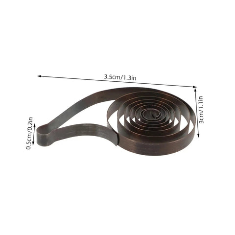 Steel Mainspring Clock Repair Kit For Mechanical Alarm Clocks 3 Pack Replacement Parts shown coiled and measured, dark brown steel