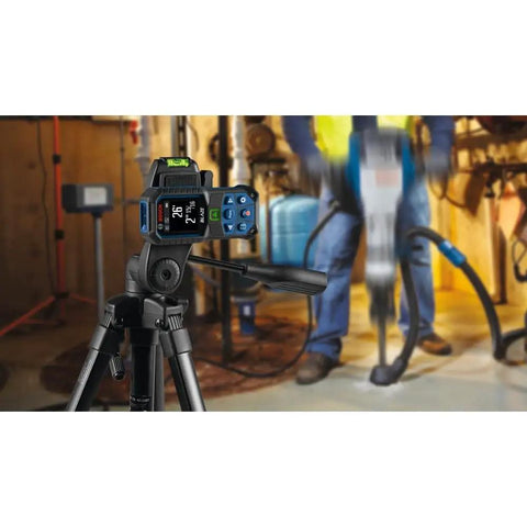Blaze Green Beam Laser Measure Up To 165 Feet With Real Time Distance Reading on tripod in construction site