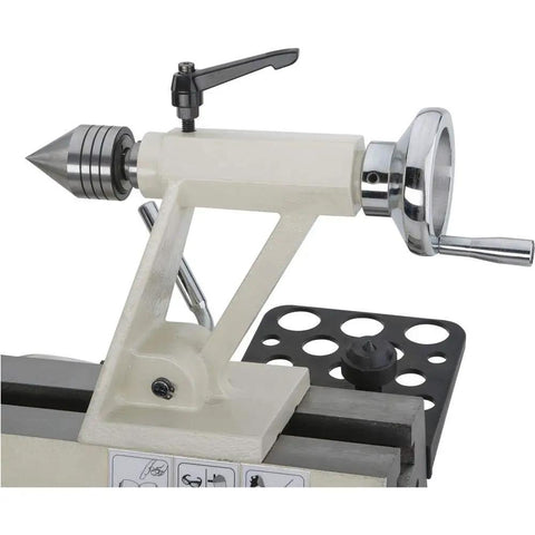 Dead Reliable Bench Top Wood Lathe With 12 Inch Swing And 15 Inch Turning Space Featuring A Zippy Three Quarter Horsepower Motor showing tailstock with precision center.