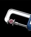 Electronic Pearl Caliper, 0.01-25mm Digital Gauge Measure Tool measuring a pink gemstone for accuracy.