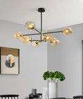 Mid Century Sputnik Chandelier Featuring Five Handblown Smoke Grey Glass Shades And Telescoping Chain Soft Golden Glow E27 Compatible in modern dining area.