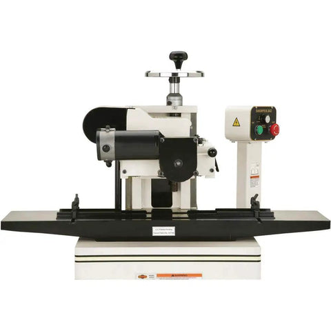 Badass Two Hp Planer Molder With Stand And Power Feed 220 Volt woodworking beast featuring precision cast iron wings and black guide rails.