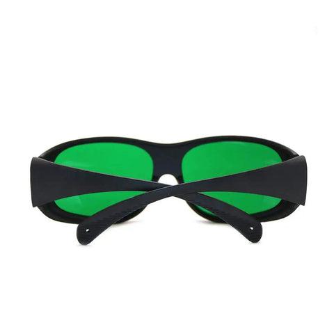 Front view of Top Shelf Red Laser Goggles Built Tough For 635nm 660nm 808nm 905nm 980nm Diode Beams with green lenses and black frame.