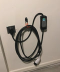 Keep Your EV Charging Cord Squared Away With This Rugged Wall Mount J Hook That Hangs Electric Vehicle Cables Up High To Dodge Rain And Dust For Stress Free Plugging Whenever You Need It. EV cable mounted on wall with charger.