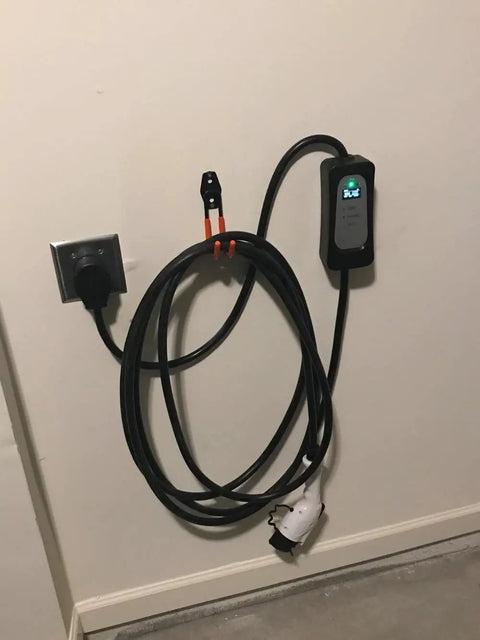 Keep Your EV Charging Cord Squared Away With This Rugged Wall Mount J Hook That Hangs Electric Vehicle Cables Up High To Dodge Rain And Dust For Stress Free Plugging Whenever You Need It. EV cable mounted on wall with charger.
