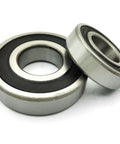 Washer Tub Bearing And Seal Kit Replacement For Whirlpool Kenmore Maytag Top Loads showing two metal bearings with black seals.