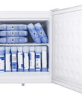 1.4 Cu Ft Compact All Freezer In Crisp White Offering No Fuss Manual Defrost And Relentless Subzero Chill To Keep Your Goods Locked Up Cold Perfect Low Key Setup For Small Kitchens And Apartments filled with ice packs.